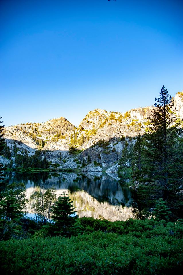 Image may contain: tree, sky, plant, mountain, cloud, outdoor, nature and water